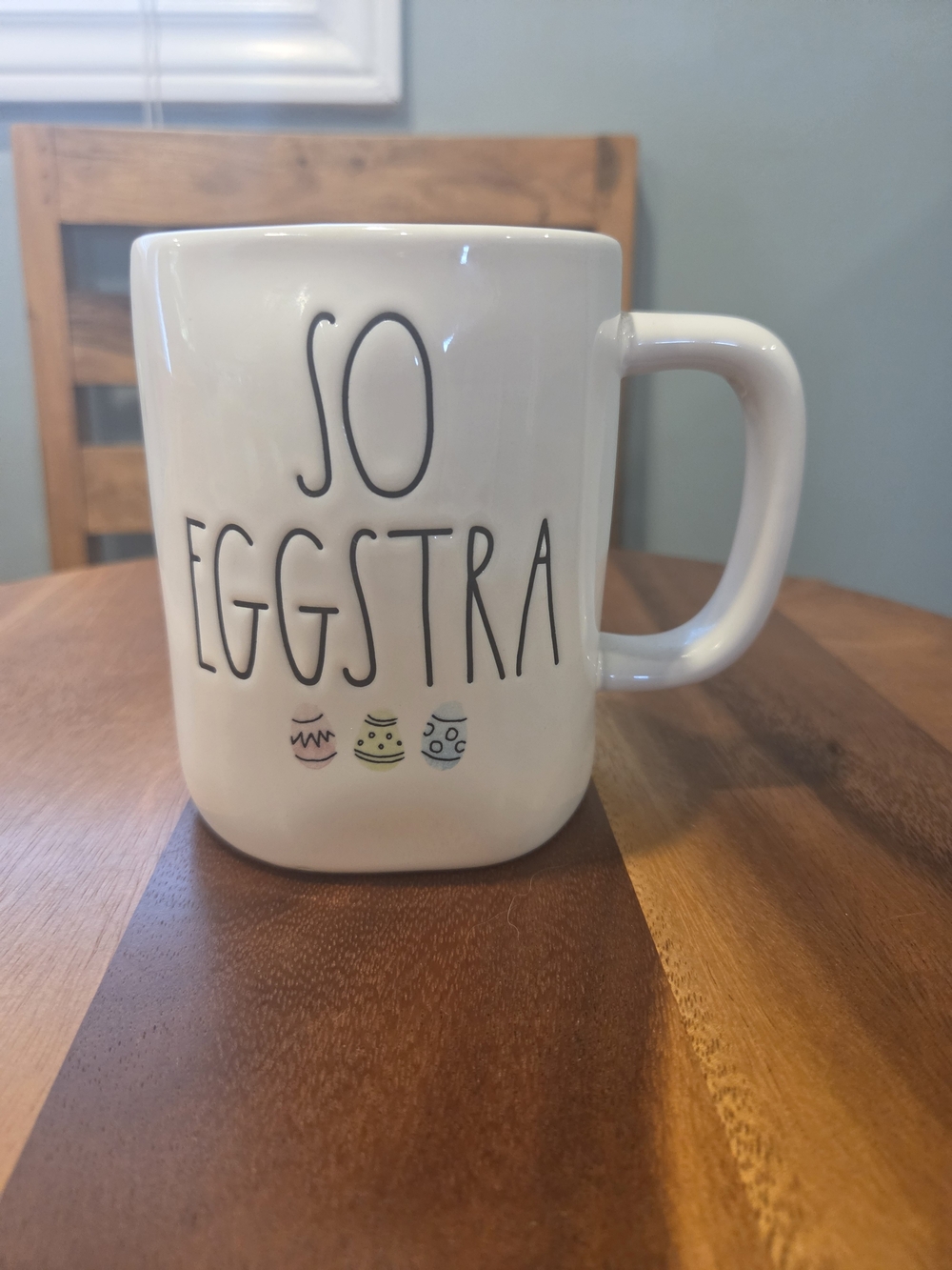 Rae Dunn White Mug with Pastel Egg Accents - "So Eggstra"
